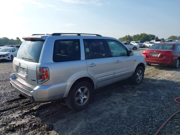 2008 Honda Pilot EX-L with VIN 5FNYF28528B027047, listed as a IAAI auction lot 42692510 with 251,260 mi miles and . Bid and sale history available at DreamBid. Image 4.
