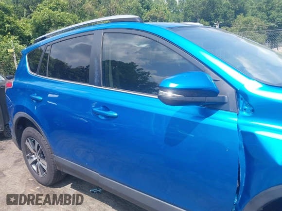 2018 Toyota RAV4 XLE with VIN JTMWFREVXJJ751586, listed as a IAAI auction lot 42586337 with 55,821 mi miles and . Bid and sale history available at DreamBid. Image 13.