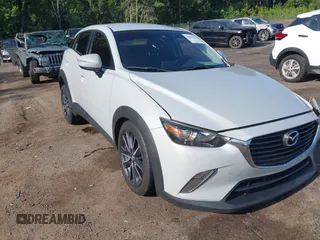 2018 Mazda CX-3 Touring with VIN JM1DKDC73J0319938, listed as a IAAI auction lot 39861564 with 117,199 mi miles. Bid and sale history available at carsss.com. Image 1.