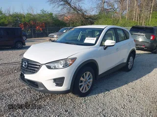 2016 Mazda CX-5 Sport with VIN JM3KE2BY2G0819604, listed as a IAAI auction lot 42059846 with 124,911 mi miles. Bid and sale history available at carsss.com. Image 2.
