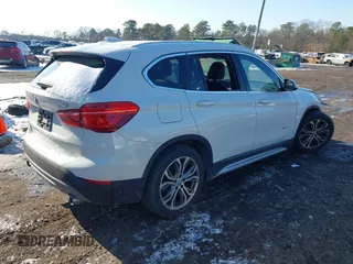 2017 BMW X1 xDrive28i with VIN WBXHT3Z36H4A52364, listed as a IAAI auction lot 41397667 with 61,960 mi miles. Bid and sale history available at carsss.com. Image 4.