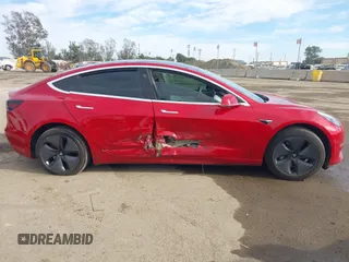2020 Tesla Model 3 Standard Range Plus with VIN 5YJ3E1EA9LF718027, listed as a IAAI auction lot 41679320 with 68,987 mi miles. Bid and sale history available at carsss.com. Image 13.