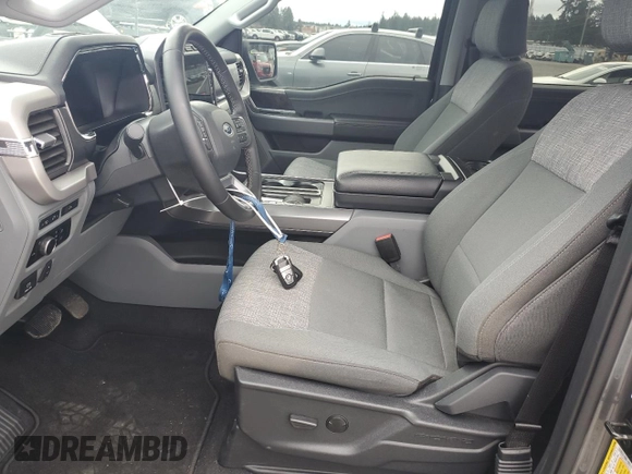 2023 Ford F-150 Lightning Pro with VIN 1FTVW1EL8PWG38419, listed as a Copart auction lot 47630535 with 11,940 mi miles and Salvage Title. Bid and sale history available at DreamBid. Image 7.