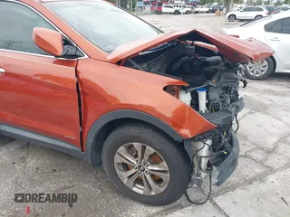 2015 Hyundai Santa Fe z VIN 5XYZT3LB7FG299504, wystawiony jako IAAI lot #42434744 z przebiegiem 104 570 mil mil oraz . Historia ofert i sprzedaży dostępna na DreamBid. Obrazek 18.
