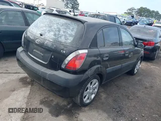 2009 Kia Rio LX with VIN KNADE243296481394, listed as a IAAI auction lot 41498863 with 59,222 mi miles. Bid and sale history available at carsss.com. Image 4.