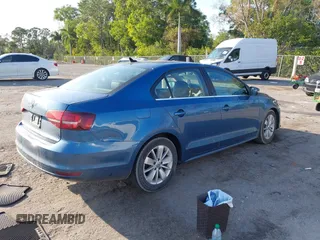 2016 Volkswagen Jetta Sedan 1.4T SE with VIN 3VWD67AJ0GM328412, listed as a IAAI auction lot 41556254 with 137,814 mi miles. Bid and sale history available at carsss.com. Image 4.