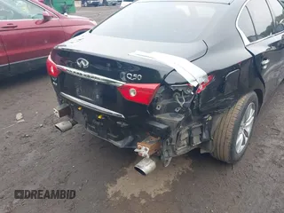 2014 Infiniti Q50 Premium z VIN JN1BV7AR4EM695232, wystawiony jako IAAI lot #42367581 z przebiegiem 138 063 mil mil oraz . Historia ofert i sprzedaży dostępna na DreamBid. Obrazek 6.
