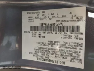 2009 Ford Focus SE with VIN 1FAHP35N79W166875, listed as a IAAI auction lot 41506700 with 174,061 mi miles. Bid and sale history available at carsss.com. Image 9.