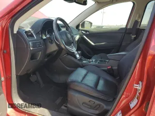 2016 Mazda CX-5 Grand Touring z VIN JM3KE2DYXG0840777, wystawiony jako Copart lot #49700585 z przebiegiem 116 469 mil mil oraz Szkoda całkowita • Salvage title. Historia ofert i sprzedaży dostępna na DreamBid. Obrazek 7.