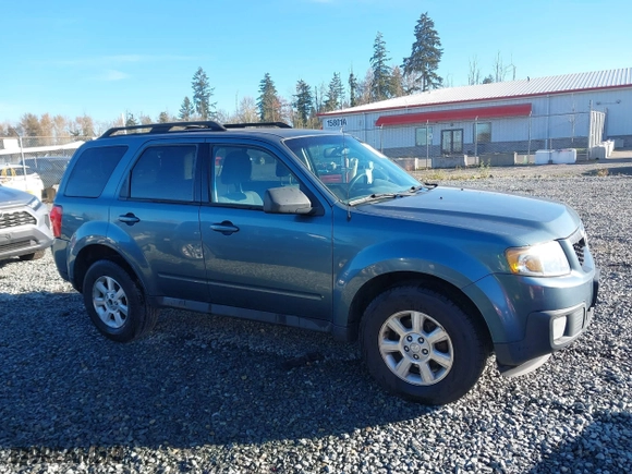 2010 Mazda Tribute Touring with VIN 4F2CY9C73AKM04595, listed as a IAAI auction lot 40797681 with 122,774 mi miles. Bid and sale history available at carsss.com. Image 13.