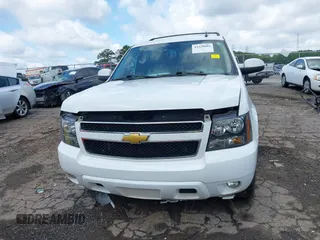 2014 Chevrolet Suburban LT with VIN 1GNSCJE07ER211222, listed as a IAAI auction lot 42428084 with 214,712 mi miles and . Bid and sale history available at DreamBid. Image 12.