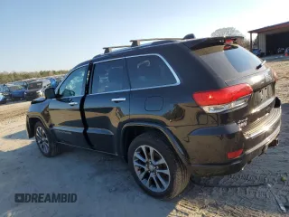 2017 Jeep Grand Cherokee Overland with VIN 1C4RJFCT5HC828780, listed as a Copart auction lot 46874965 with 90,269 mi miles and Salvage Title. Bid and sale history available at carsss.com. Image 2.