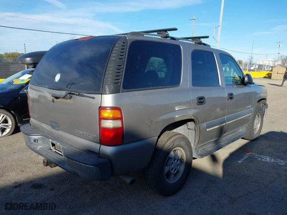 2003 Chevrolet Tahoe LS with VIN 1GNEC13V13J163837, listed as a IAAI auction lot 41641915 with 102,312 mi miles. Bid and sale history available at carsss.com. Image 4.