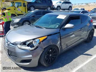 2015 Hyundai Veloster with VIN KMHTC6AD1FU233648, listed as a IAAI auction lot 41822881 with 162,368 mi miles. Bid and sale history available at carsss.com. Image 2.