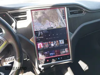 2013 Tesla Model S z VIN 5YJSA1DN4DFP19552, wystawiony jako IAAI lot #41360466 z przebiegiem 129 806 mil mil oraz . Historia ofert i sprzedaży dostępna na DreamBid. Obrazek 19.
