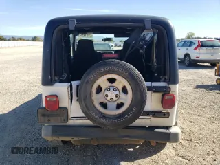 2006 Jeep Wrangler Sport Right Hand Drive with VIN 1J4F449S76P747454, listed as a Copart auction lot 77819214 with 184,763 mi miles and Salvage Title. Bid and sale history available at carsss.com. Image 6.