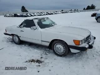 1986 Mercedes-Benz 560 SL with VIN WDBBA48D8GA042178, listed as a Copart auction lot 41809525 with 80,788 mi miles and Salvage Title. Bid and sale history available at DreamBid. Image 4.