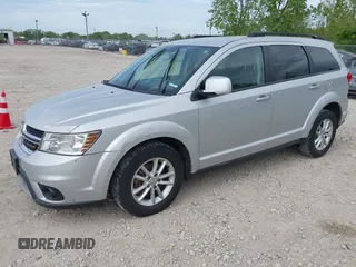 2014 Dodge Journey SXT with VIN 3C4PDCBG9ET209357, listed as a IAAI auction lot 42257467 with 121,786 mi miles and . Bid and sale history available at DreamBid. Image 2.