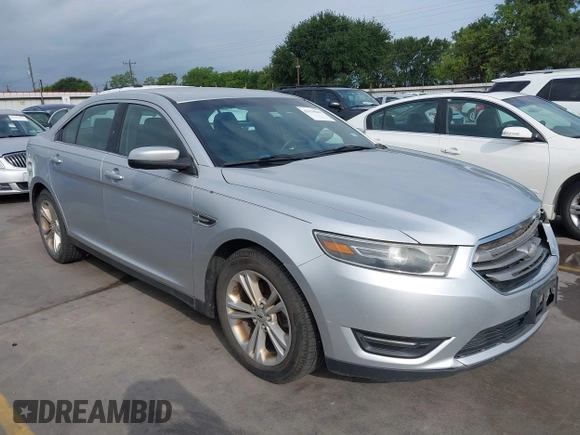 2015 Ford Taurus SEL z VIN 1FAHP2E88FG133328, wystawiony jako IAAI lot #42179649 z przebiegiem 127 171 mil mil oraz . Historia ofert i sprzedaży dostępna na DreamBid. Obrazek 1.