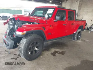 2021 Jeep Gladiator Willys z VIN 1C6HJTAG7ML602130, wystawiony jako IAAI lot #42161745 z przebiegiem 49 576 mil mil oraz . Historia ofert i sprzedaży dostępna na DreamBid. Obrazek 2.