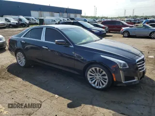 2015 Cadillac CTS Luxury AWD with VIN 1G6AX5SX7F0125516, listed as a Copart auction lot 61072735 with 111,448 mi miles and Clean title. Bid and sale history available at DreamBid. Image 4.
