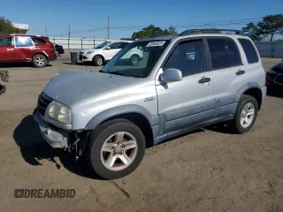 2003 Suzuki Grand Vitara z VIN JS3TE62V634101844, wystawiony jako Copart lot #52848525 z przebiegiem 132 712 mil mil oraz Szkoda całkowita • Salvage title. Historia ofert i sprzedaży dostępna na DreamBid. Obrazek 1.