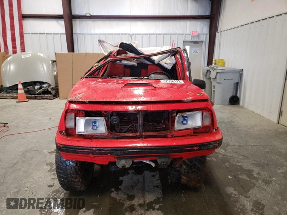 1992 Geo Tracker z VIN 2CNBJ18U1N6917736, wystawiony jako Copart lot #76609574 z przebiegiem Nie podano mil oraz Szkody całkowita. Historia ofert i sprzedaży dostępna na DreamBid. Obrazek 5.