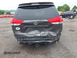 2014 Toyota Sienna XLE with VIN 5TDYK3DC0ES436502, listed as a IAAI auction lot 42180990 with 154,839 mi miles and . Bid and sale history available at DreamBid. Image 6.