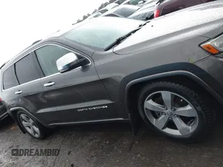 2014 Jeep Grand Cherokee Overland with VIN 1C4RJFCT2EC146239, listed as a IAAI auction lot 41368514 with 164,239 mi miles. Bid and sale history available at carsss.com. Image 13.