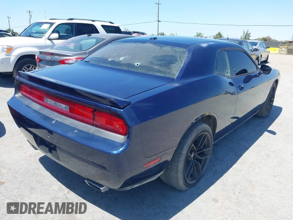 2013 Dodge Challenger R/T z VIN 2C3CDYBT9DH565280, wystawiony jako IAAI lot #42315527 z przebiegiem 128 638 mil mil oraz . Historia ofert i sprzedaży dostępna na DreamBid. Obrazek 4.