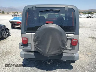 2000 Jeep Wrangler SE with VIN 1J4FA29P7YP737289, listed as a Copart auction lot 61869865 with 91,097 mi miles and Salvage title. Bid and sale history available at DreamBid. Image 6.