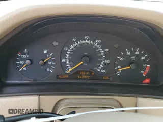 1999 Mercedes-Benz E-Class with VIN WDBJH65F3XA749696, listed as a Copart auction lot 77656084 with 163,802 mi miles and Salvage Title. Bid and sale history available at carsss.com. Image 9.