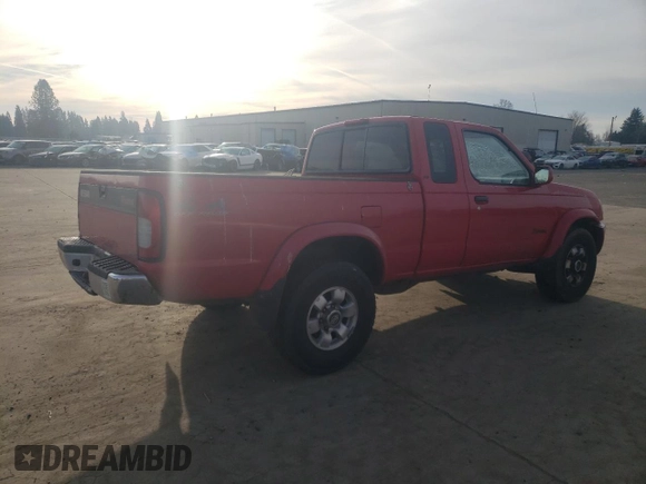 1999 Nissan Frontier XE with VIN 1N6ED26Y2XC312863, listed as a Copart auction lot 42259015 with 212,666 mi miles and Salvage title. Bid and sale history available at DreamBid. Image 3.