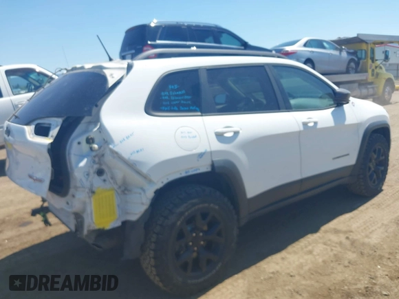 2014 Jeep Cherokee Trailhawk with VIN 1C4PJMBSXEW236807, listed as a IAAI auction lot 42660980 with 157,225 mi miles and . Bid and sale history available at DreamBid. Image 4.
