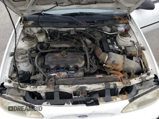 1999 Ford Escort LX with VIN 1FAFP10P7XW221648, listed as a Copart auction lot 71844334 with 140,899 mi miles and Salvage Title. Bid and sale history available at carsss.com. Image 11.