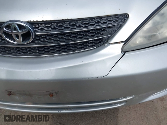 2002 Toyota Camry LE z VIN 4T1BE32K42U029129, wystawiony jako IAAI lot #42190162 z przebiegiem 191 423 mil mil oraz . Historia ofert i sprzedaży dostępna na DreamBid. Obrazek 6.