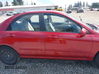2009 Kia Spectra EX with VIN KNAFE222195661572, listed as a IAAI auction lot 42148750 with 137,773 mi miles. Bid and sale history available at carsss.com. Image 14.