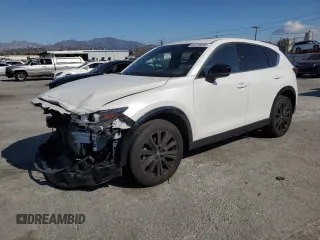 2022 Mazda CX-5 2.5 Turbo with VIN JM3KFBAY5N0525299, listed as a Copart auction lot 44736945 with 53,890 mi miles and Salvage Title. Bid and sale history available at carsss.com. Image 1.
