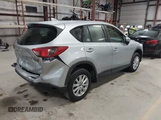 2016 Mazda CX-5 Sport with VIN JM3KE2BY2G0718434, listed as a IAAI auction lot 41961364 with 145,748 mi miles. Bid and sale history available at carsss.com. Image 4.