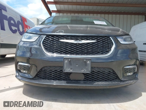 2023 Chrysler Pacifica Touring L with VIN 2C4RC1BG1PR550628, listed as a IAAI auction lot 42553430 with 61,773 mi miles and . Bid and sale history available at DreamBid. Image 19.