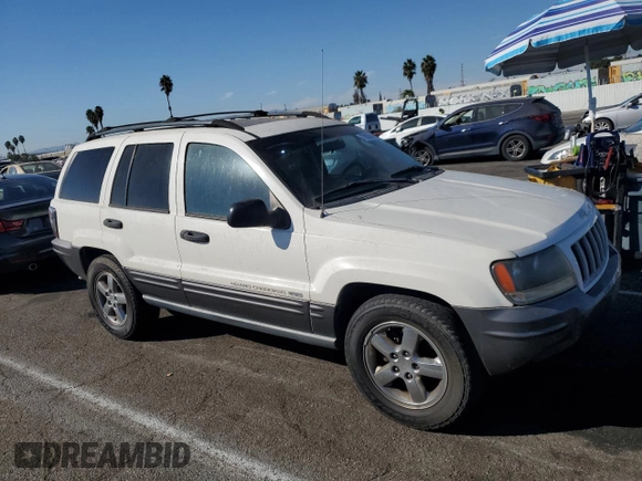 2004 Jeep Grand Cherokee with VIN 1J4GX48JX4C301369, listed as a Copart auction lot 77803094 with 179,404 mi miles and Clean title. Bid and sale history available at DreamBid. Image 4.