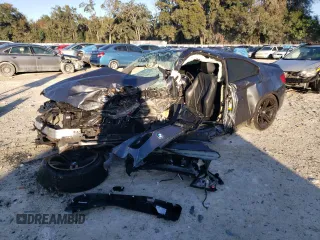 2018 BMW M2 with VIN WBS1J5C50J7B70191, listed as a Copart auction lot 86976284 with 0 mi miles and Salvage Title. Bid and sale history available at carsss.com. Image 1.