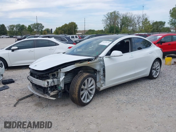2019 Tesla Model 3 Mid Range z VIN 5YJ3E1EA5KF466517, wystawiony jako IAAI lot #40296116 z przebiegiem 66 509 mil mil oraz . Historia ofert i sprzedaży dostępna na DreamBid. Obrazek 2.