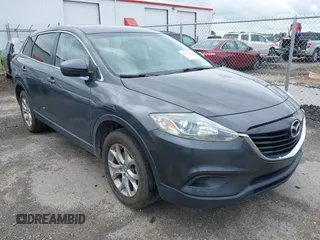 2014 Mazda CX-9 Touring z VIN JM3TB2CAXE0445450, wystawiony jako IAAI lot #42477260 z przebiegiem 139 583 mil mil oraz . Historia ofert i sprzedaży dostępna na DreamBid. Obrazek 1.