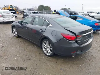 2016 Mazda Mazda6 i Touring with VIN JM1GJ1V56G1462637, listed as a IAAI auction lot 41603296 with 143,931 mi miles. Bid and sale history available at carsss.com. Image 3.