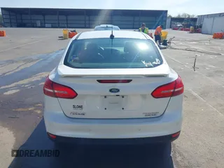 2016 Ford Focus Titanium z VIN 1FADP3J23GL358772, wystawiony jako IAAI lot #42103694 z przebiegiem 85 290 mil mil oraz . Historia ofert i sprzedaży dostępna na DreamBid. Obrazek 16.