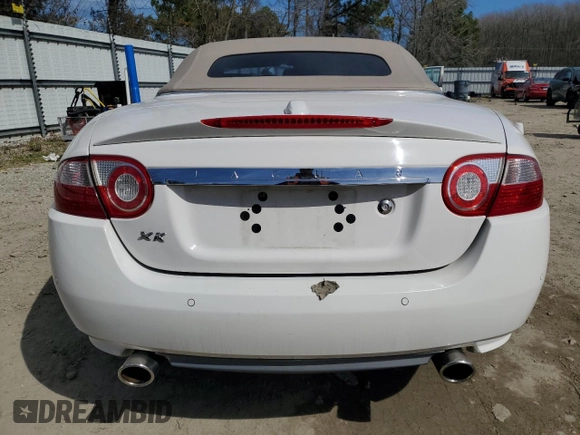 2007 Jaguar XK with VIN SAJDA44B775B05606, listed as a Copart auction lot 49419515 with 115,607 mi miles and Salvage Title. Bid and sale history available at DreamBid. Image 6.