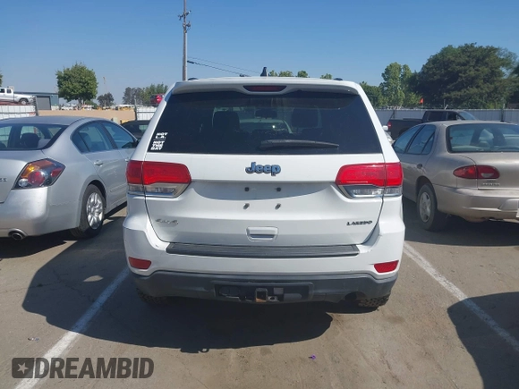 2014 Jeep Grand Cherokee Laredo with VIN 1C4RJFAG9EC334021, listed as a IAAI auction lot 42128823 with 161,741 mi miles. Bid and sale history available at carsss.com. Image 16.