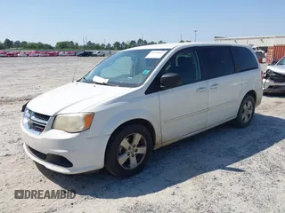 2013 Dodge Grand Caravan SE with VIN 2C4RDGBG9DR516044, listed as a IAAI auction lot 41998893 with 214,645 mi miles and . Bid and sale history available at DreamBid. Image 2.