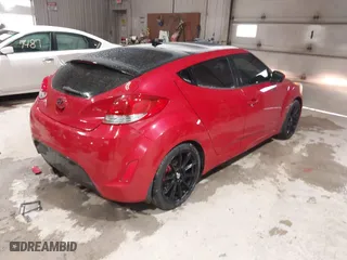 2012 Hyundai Veloster w/Black Int with VIN KMHTC6AD8CU032759, listed as a IAAI auction lot 41567265 with 156,973 mi miles. Bid and sale history available at carsss.com. Image 4.